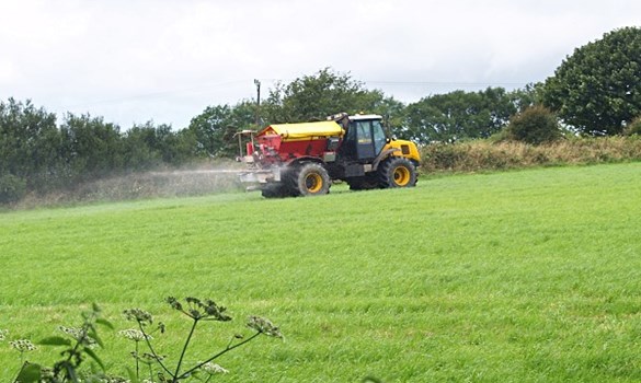 Tractor spraying crops